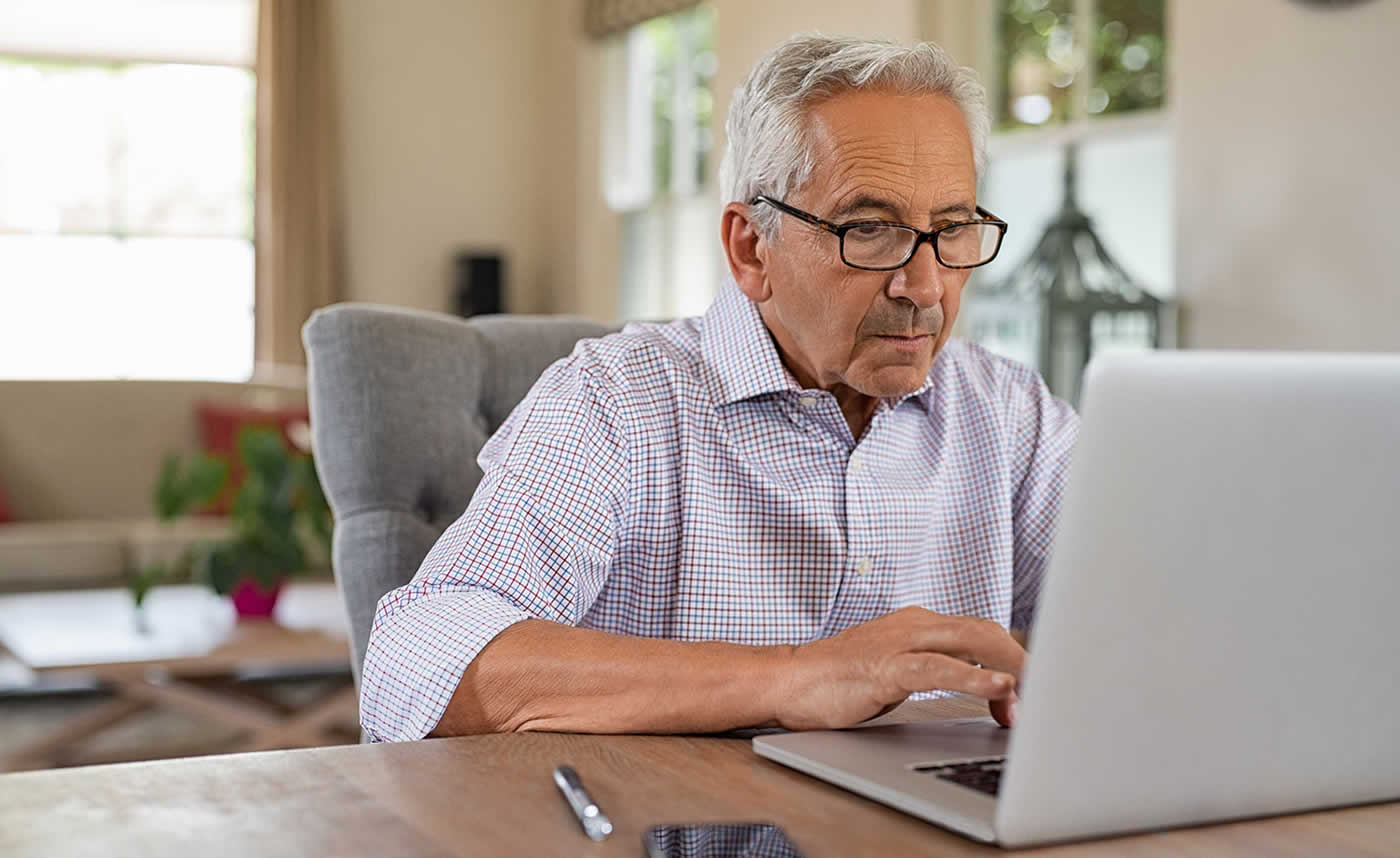 Older Man on Laptop at Home